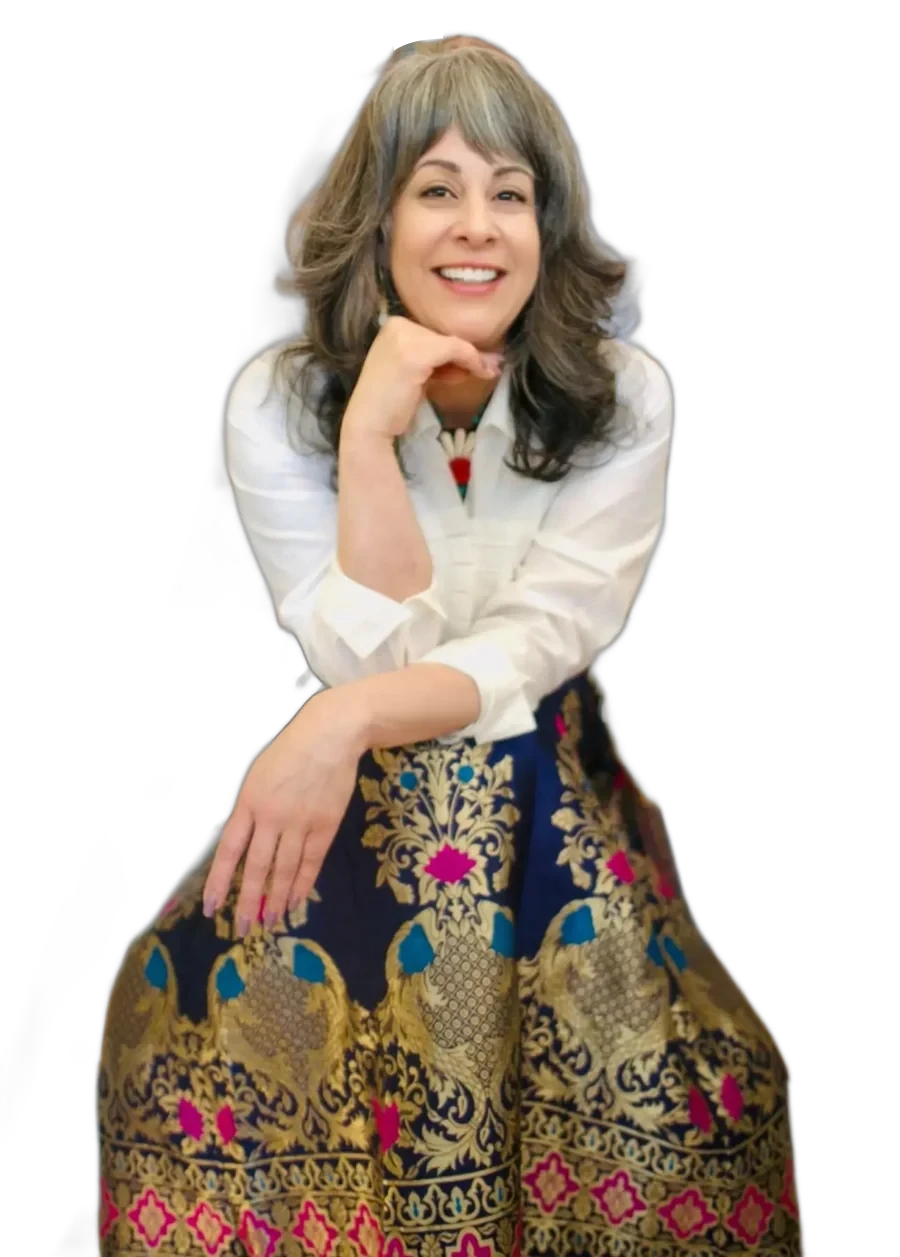 Kristina Soto, founder of The Gracewell Studio, in a white shirt and an embroidered navy skirt